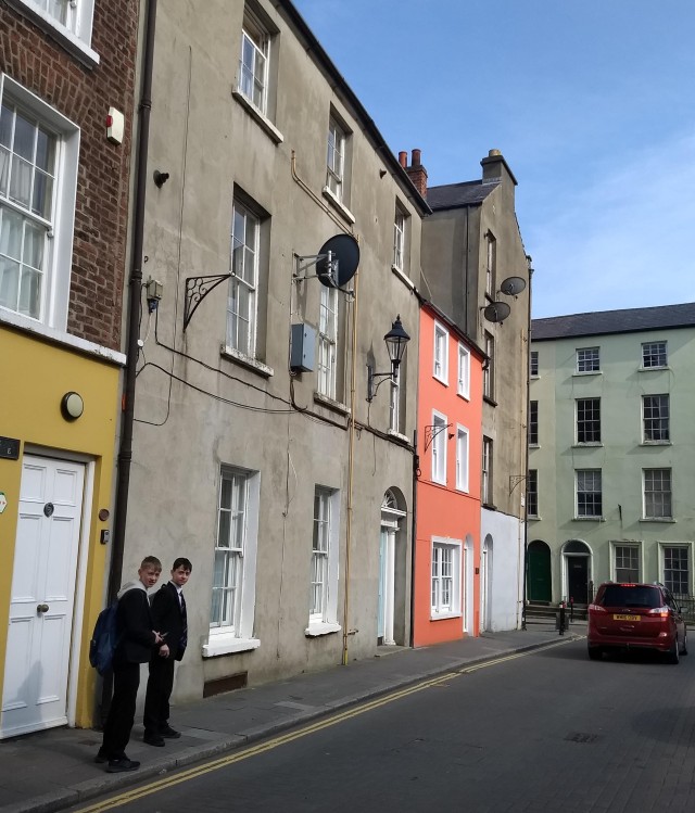 Quiet street in Ireland with two catholic school boys.